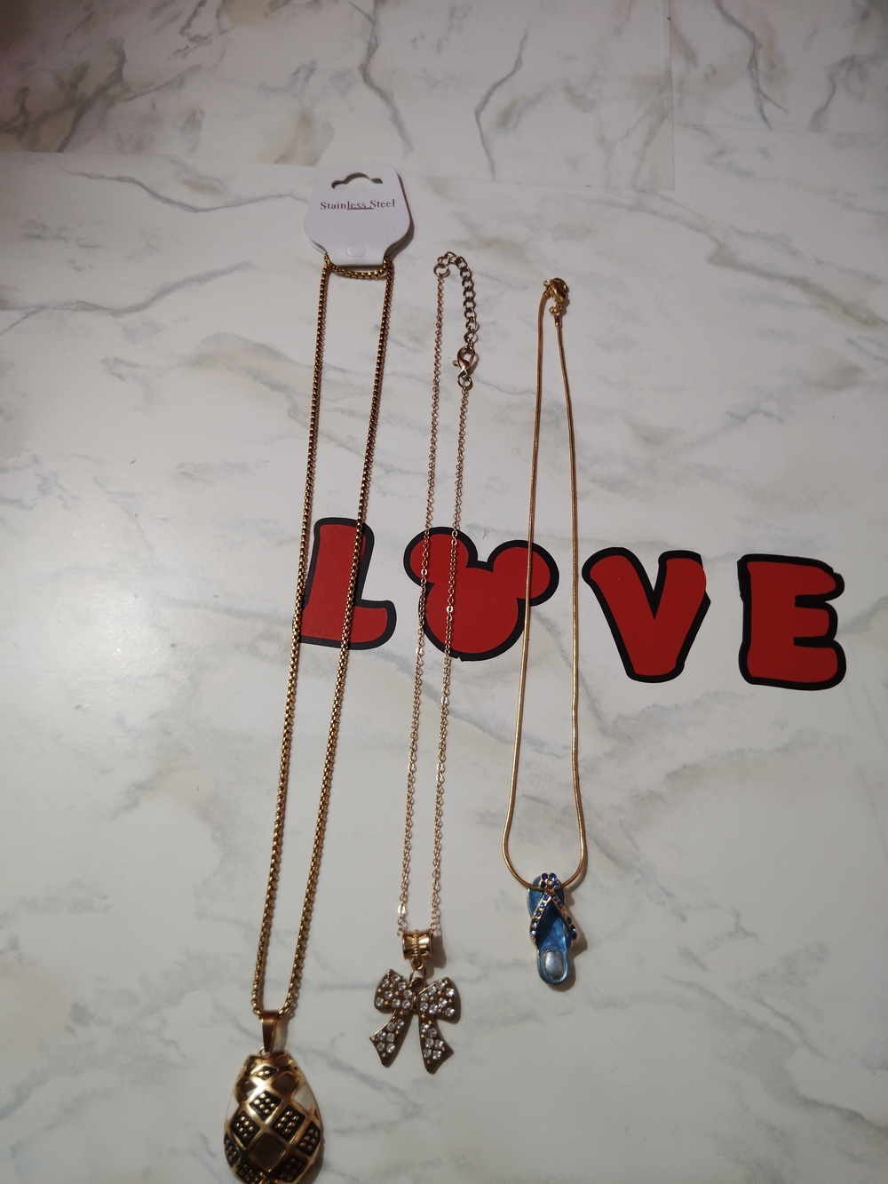 Gold-Tone Bow and Pineapple Pendant Necklaces - Gold